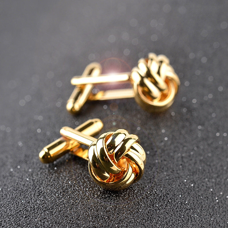 Interlaced Knot Cufflinks - Ashford — Gold-tone finish: raised knot on a dark background